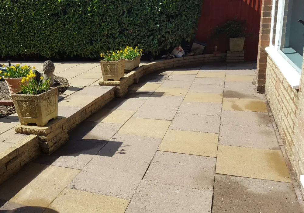 The same patio after cleaning, with the slabs restored